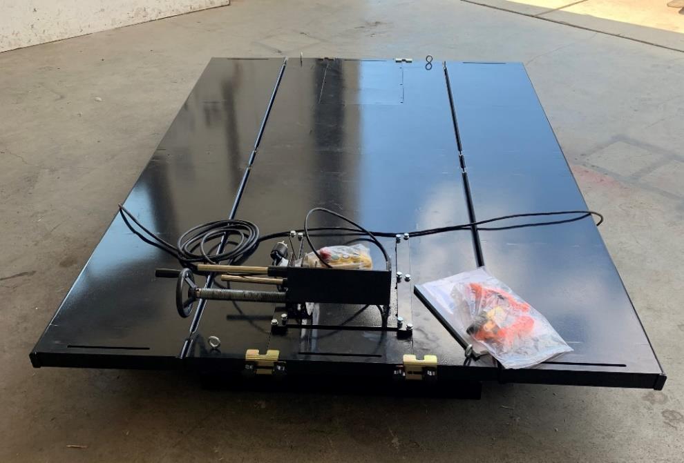 Top view of the Performance Hoist motorcycle lift platform with the extensions, wheel chock and controls