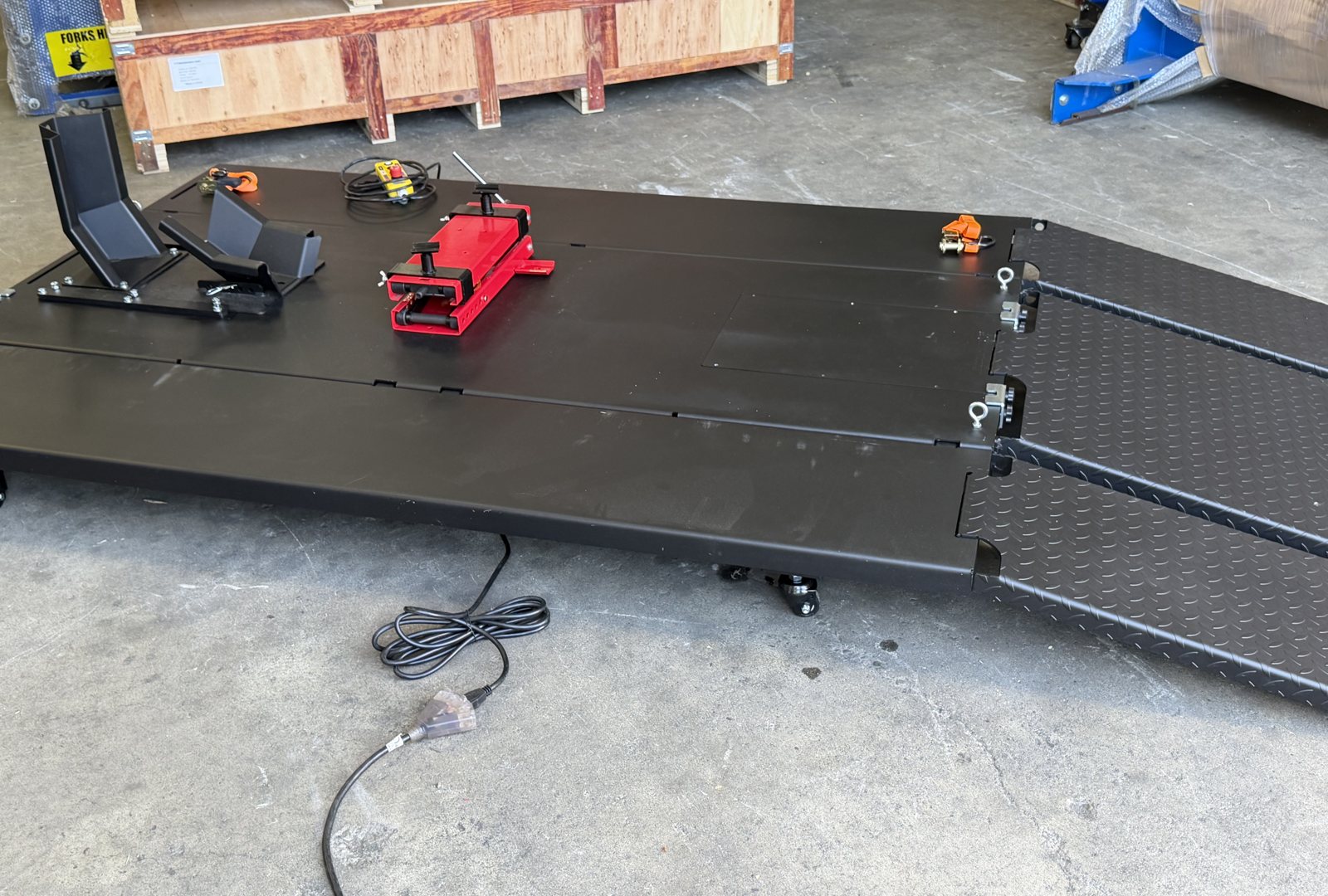Performance Hoist motorcycle and ATV lift raised on its castors